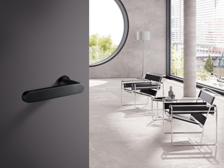 HEWI lever handle mini black matt Office building door fitted with a black lever handle