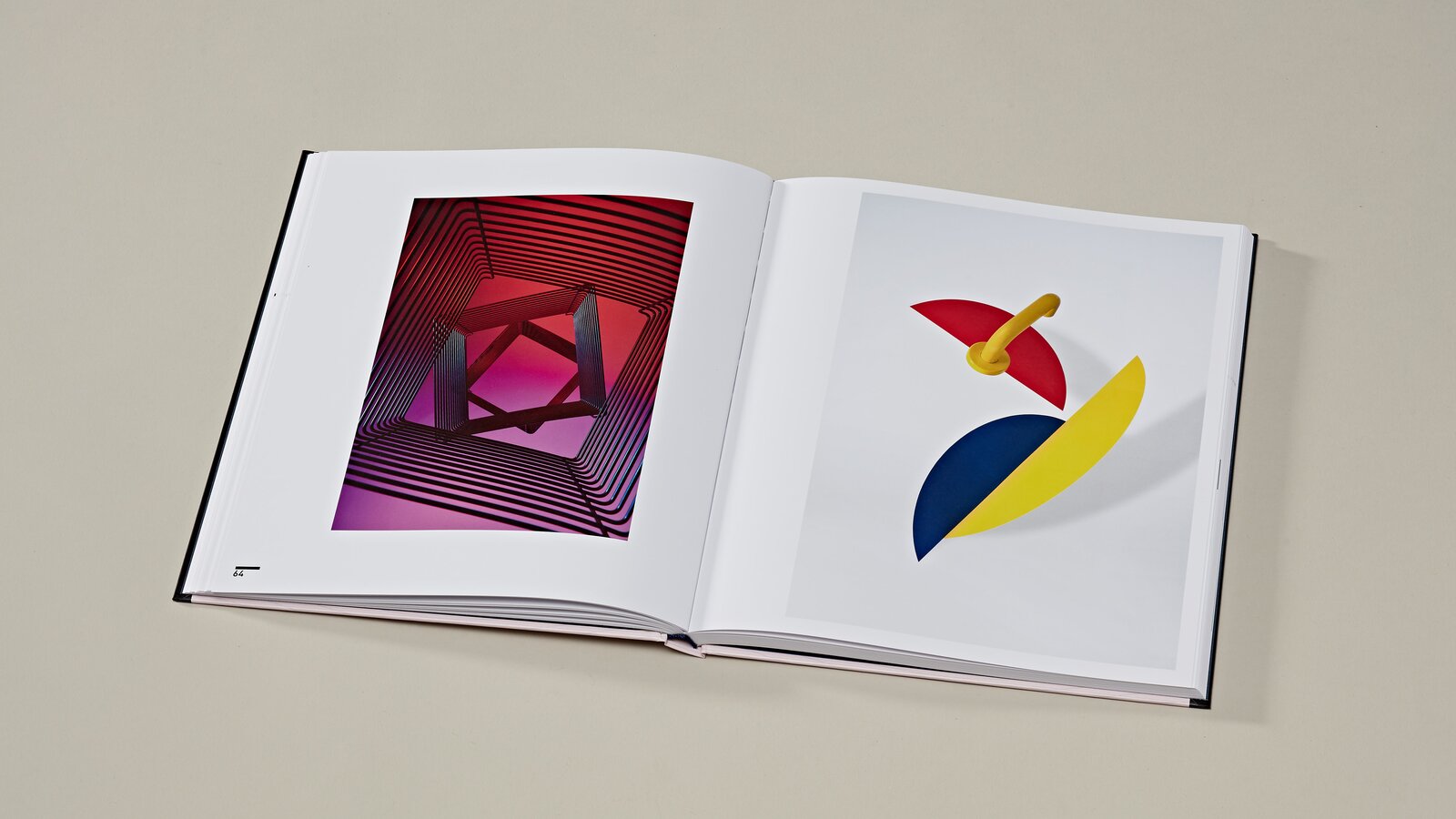 Re:Form Art volume Bauhaus 2 open pages of the art book on the Bauhaus exhibition on the right HEWI lever handle 111 in mustard yellow